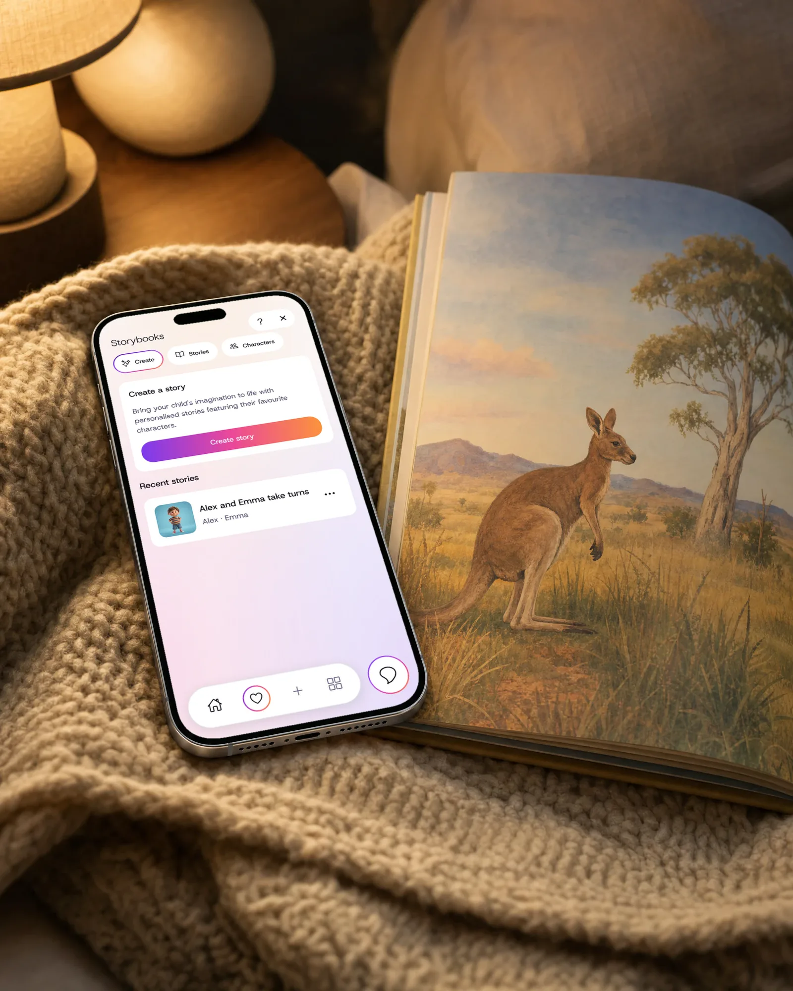 A phone on a blanket beside a picture book, showing Storybook